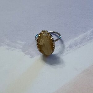 Elegant Gold-Toned Ring with Yellow Stone
